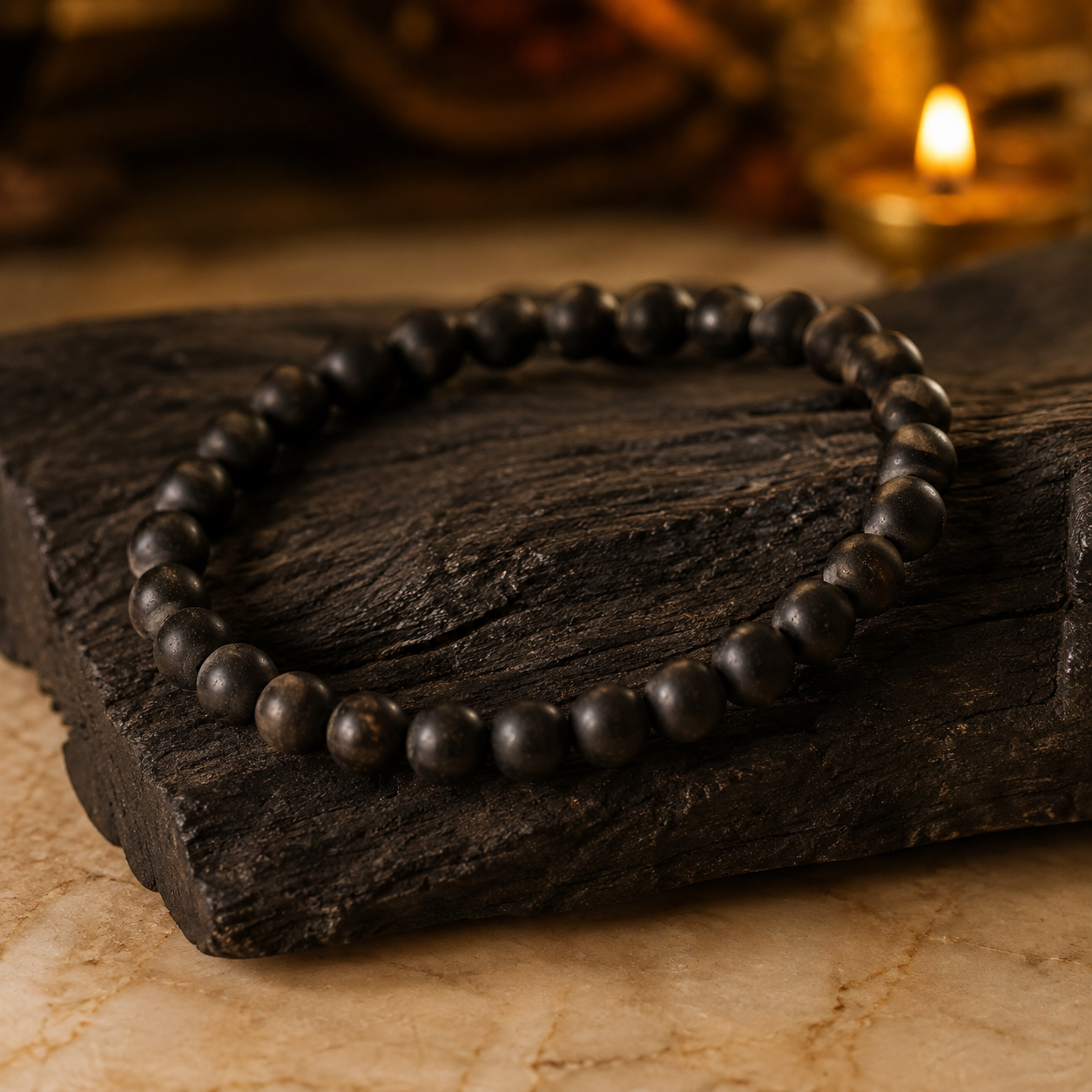 Plain Karungali bracelet displayed on dark natural wood