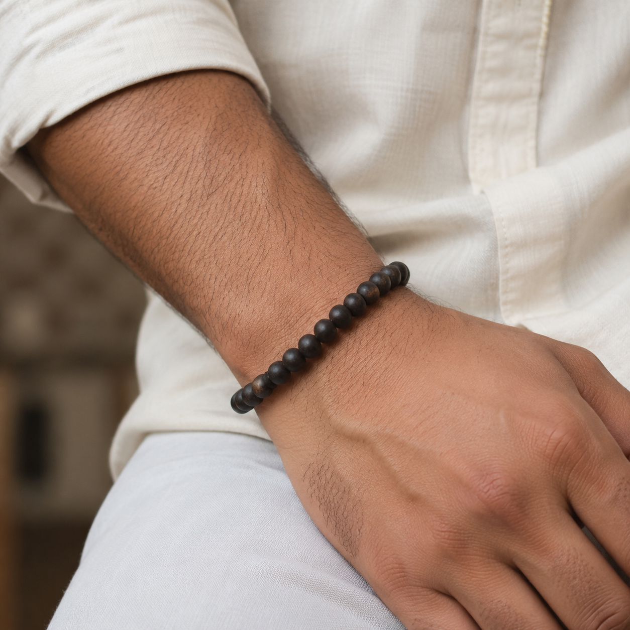 Plain Karungali bracelet worn on an adult wrist