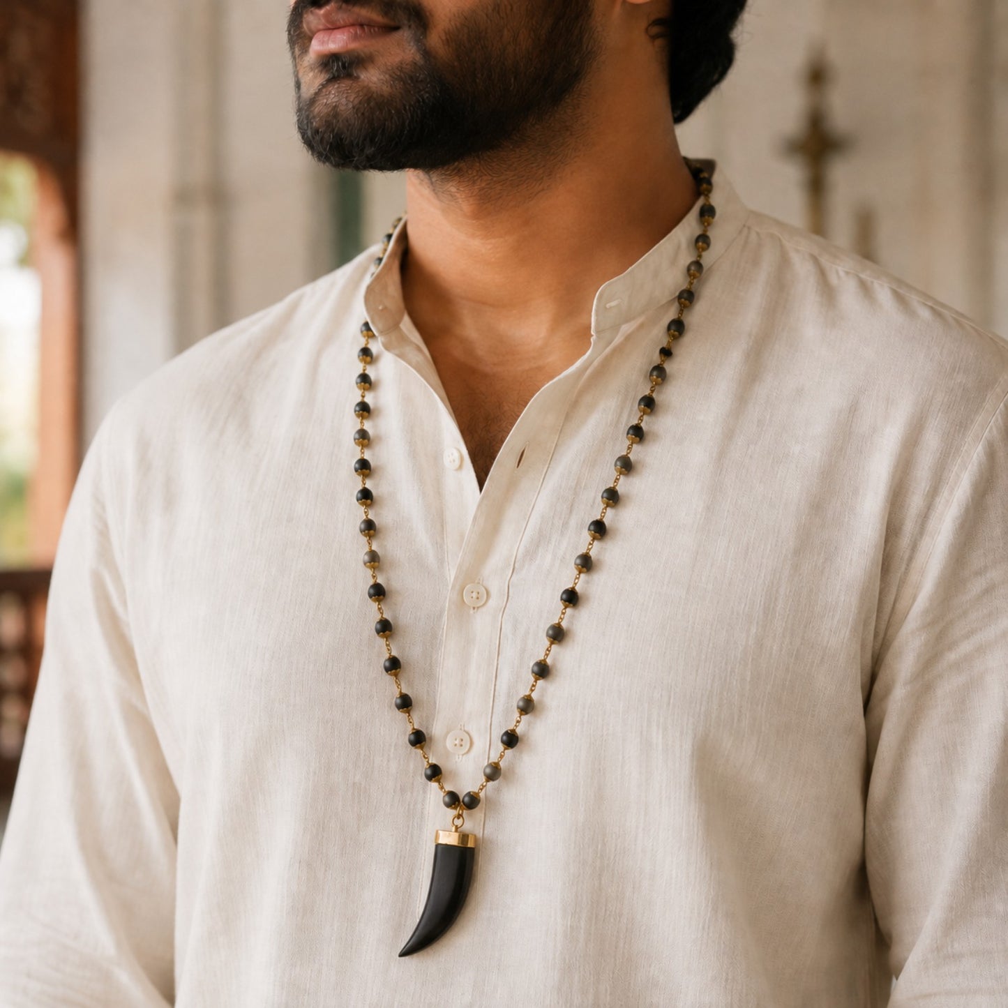 Gold Tiger Tooth Design Karungali Mala worn by a model