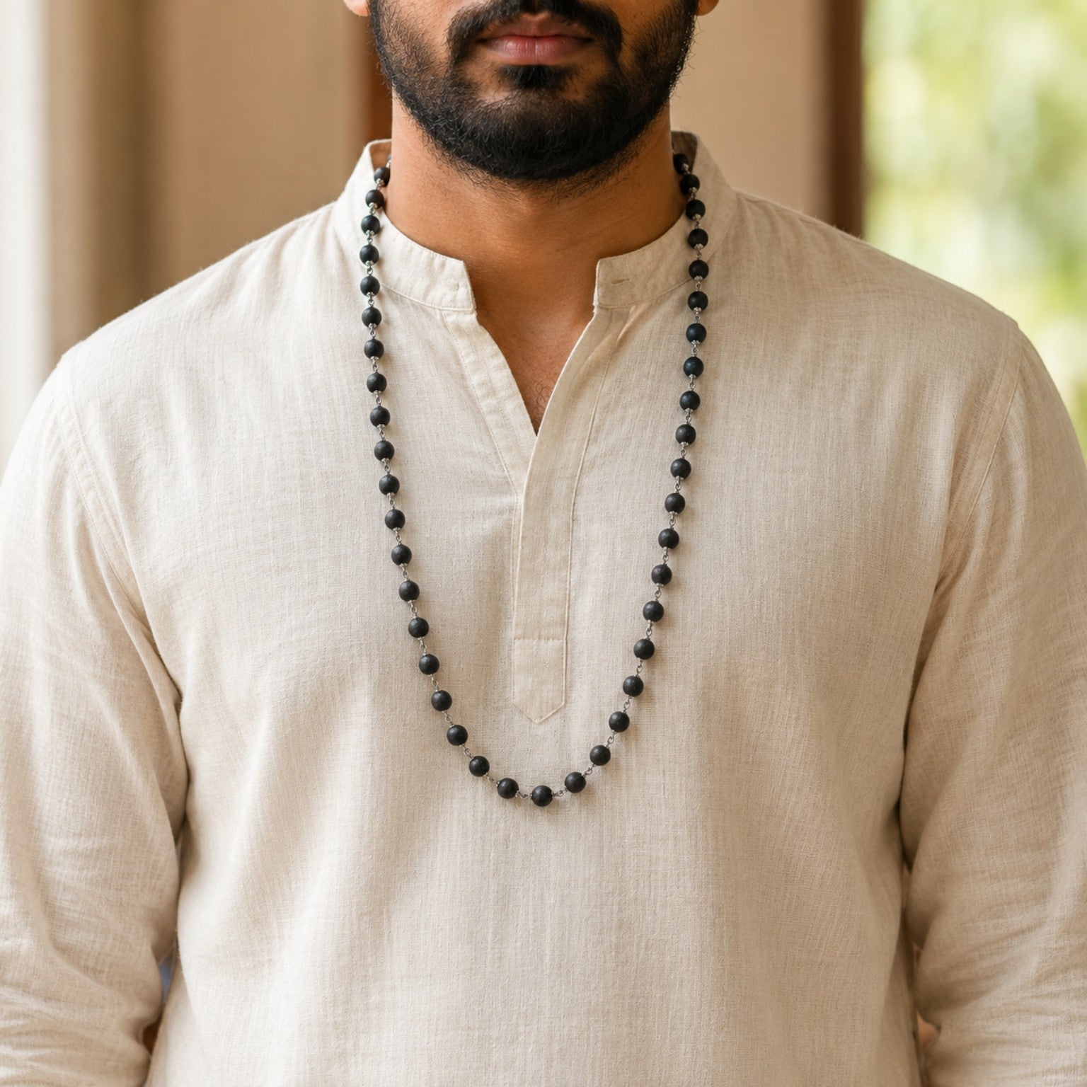 Silver-Finish Karungali Mala worn by a model
