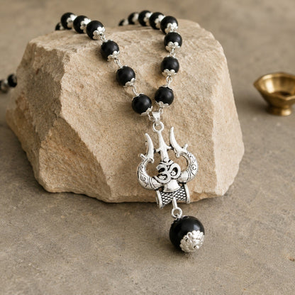 Silver Om Trishul Karungali Mala on stone